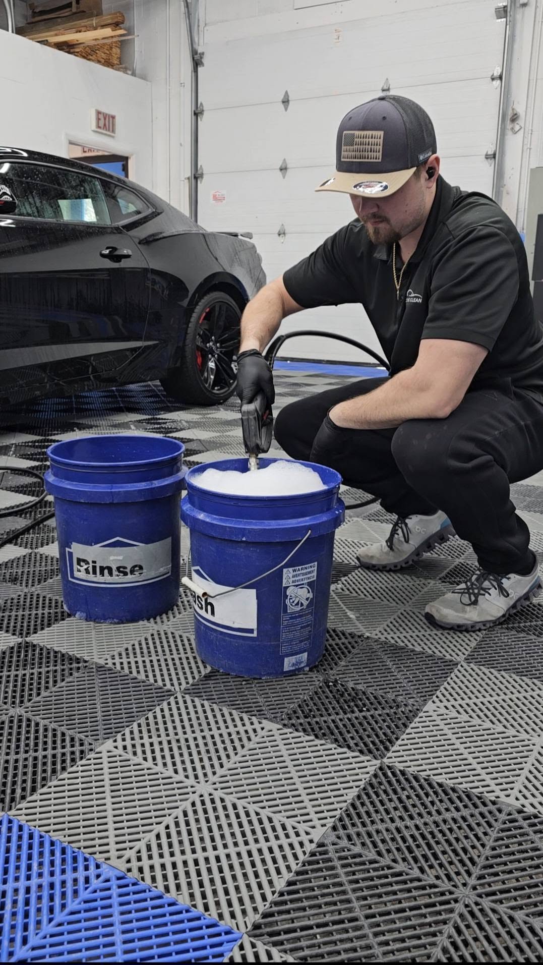 Gerard safely washing a ceramic-coated vehicle at Pristine Clean